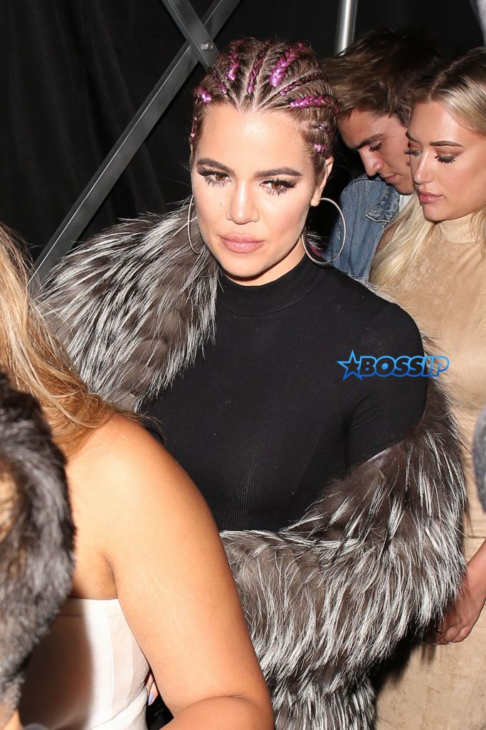 West Hollywood, CA - West Hollywood, CA - Khloe Kardashian takes a selfie with a fan as she arrives at her half sister Kylie's early birthday party. The KUWTK star wore a faux fur coat over a black dress and knee high black boots. Khloe showed off her stylish purple braided hair at the party. AKM-GSI 31 JULY 2016 To License These Photos, Please Contact : Maria Buda (917) 242-1505 mbuda@akmgsi.com or Mark Satter (317) 691-9592 msatter@akmgsi.com sales@akmgsi.com