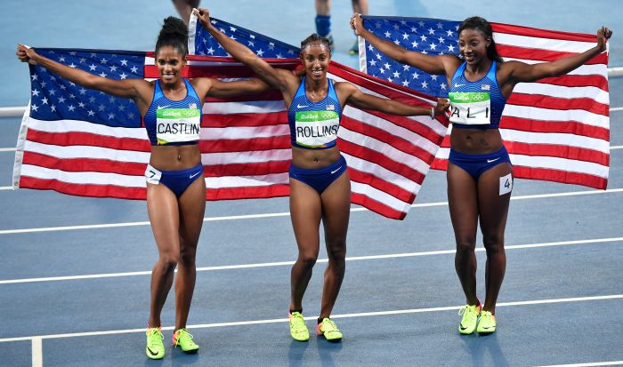 Gold medal winner United States' Brianna Rollins, center, silver medal winner United States' Nia Ali, right, and bronze medal winner United States' Kristi Castlin celebrate after the women's 100-meter hurdles final during the athletics competitions of the 2016 Summer Olympics at the Olympic stadium in Rio de Janeiro, Brazil, Wednesday, Aug. 17, 2016.