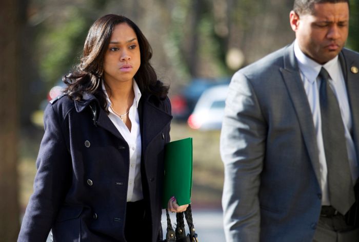FILE - In this March 3, 2016, file photo, Baltimore State's Attorney Marilyn Mosby, left, arrives at Maryland Court of Appeals in Annapolis, Md. Baltimore Mayor Stephanie Rawlings-Blake is firing back at Mosby for critical comments she made in a magazine profile. Rawlings-Blake told reporters Wednesday, Sept. 28, 2016, that Mosby rushed to prosecute six police officers in the death of Fredie Gray, a young black man whose neck was broken in the back of a transport wagon. The mayor's comments were in response to a profile of Mosby in The New York Times Magazine in which she said the mayor disseminated false information about the investigation into Gray's death. (AP Photo/Jose Luis Magana, File)