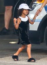 FameFlynetPictures Khloe Kardashian Tristan Thompson Miami Lunch Kim Kardashian holding hands fitted pants tank tops sunglasses North West
