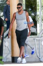 FameFlynetPictures Khloe Kardashian Tristan Thompson Miami Lunch Kim Kardashian holding hands fitted pants tank tops sunglasses North West