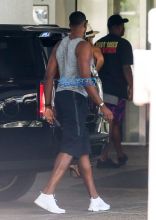 FameFlynetPictures Khloe Kardashian Tristan Thompson Miami Lunch Kim Kardashian holding hands fitted pants tank tops sunglasses North West