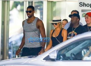 FameFlynetPictures Khloe Kardashian Tristan Thompson Miami Lunch Kim Kardashian holding hands fitted pants tank tops sunglasses North West