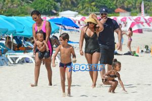 Saint West and North West Miami with their cousins Mason and Penelope nannies bodyguards. black bikini pink bucket ocean AKM-GSI