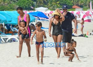 Saint West and North West Miami with their cousins Mason and Penelope nannies bodyguards. black bikini pink bucket ocean AKM-GSI