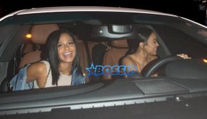 Karrueche Tran best friend Christina Milian dinner 'Catch' Restaurant orange silk crop top matching pants cream fitted dress oversize embroidered jean jacket SplashNews