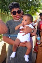 Rihanna Barbados. christening of cousin Nikolai. 11am to the Power In the Blood Assembly bestie Melissa baby blue dress and long dreadlocks. Majesty in her lap. baby's mother Nicolette, grandmother Marcel, cousin Noella altar Nikolai's dedication. SplashNews