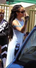 Rihanna Barbados. christening of cousin Nikolai. 11am to the Power In the Blood Assembly bestie Melissa baby blue dress and long dreadlocks. Majesty in her lap. baby's mother Nicolette, grandmother Marcel, cousin Noella altar Nikolai's dedication. SplashNews