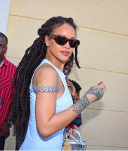 Rihanna Barbados. christening of cousin Nikolai. 11am to the Power In the Blood Assembly bestie Melissa baby blue dress and long dreadlocks. Majesty in her lap. baby's mother Nicolette, grandmother Marcel, cousin Noella altar Nikolai's dedication. SplashNews