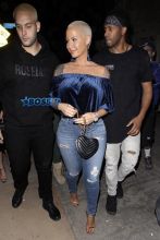 Amber Rose leaves Delilah in West Hollywood. 32-year-old off-shoulder blue velvet top jeans and gold heels. AKM-GSI