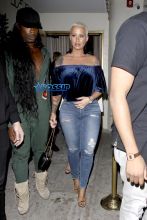Amber Rose leaves Delilah in West Hollywood. 32-year-old off-shoulder blue velvet top jeans and gold heels. AKM-GSI