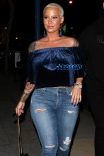 Amber Rose leaves Delilah in West Hollywood. 32-year-old off-shoulder blue velvet top jeans and gold heels. AKM-GSI