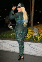 London "Deelishis" Charles poses in sheer green catsuit outside Sirius XM in NYC AKM-GSI