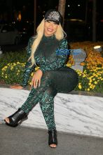 London "Deelishis" Charles poses in sheer green catsuit outside Sirius XM in NYC AKM-GSI