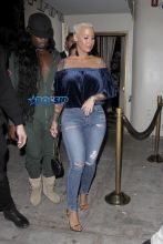 Amber Rose leaves Delilah in West Hollywood. 32-year-old off-shoulder blue velvet top jeans and gold heels. AKM-GSI