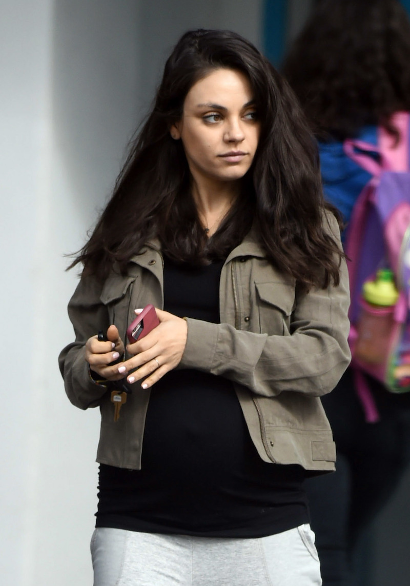Pregnant Mila Kunis shows off her baby bump