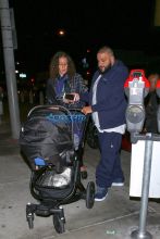 DJ Khaled fiancée Nicole Tuck newborn son Asahd Tuck Khaled to Catch LA in West Hollywood. The couple welcomed baby Asahd just under a month ago. blue track suit, stroller AKM-GSI