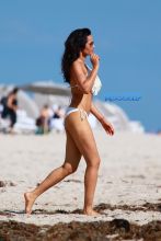 White fringe bikini model Top Chef judge Padma Lakshmi daughter Krishna family beach in Miami, Florida.