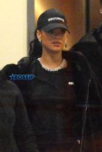 Rihanna and her entourage leave a hotel in New York City. The pop star diva wore all black with a Security hat, matching black Security t-shirt and sparkling jewelry. AKM-GSI