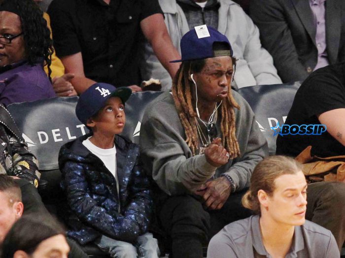Lil Wayne at the Los Angeles Lakers game with his son