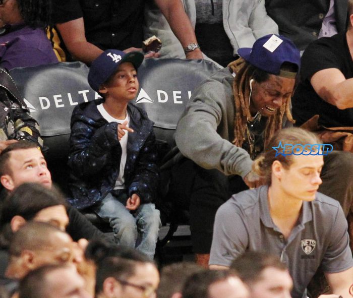 Lil Wayne at the Los Angeles Lakers game with his son. The Los Angeles Lakers defeated the Brooklyn Nets by the final score of 125-118 at Staples Center in downton Los Angeles. Featuring: Lil Wayne, son Where: Los Angeles, California, United States When: 15 Nov 2016 Credit: WENN.com