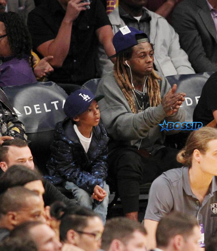 Lil Wayne at the Los Angeles Lakers game with his son. The Los Angeles Lakers defeated the Brooklyn Nets by the final score of 125-118 at Staples Center in downton Los Angeles. Featuring: Lil Wayne, son Where: Los Angeles, California, United States When: 15 Nov 2016 Credit: WENN.com