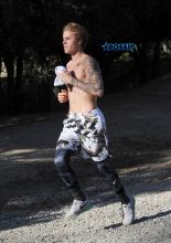 Justin Bieber shirtless run in Los Angeles. pop singer tattoos workout WENN
