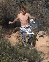 Justin Bieber shirtless run in Los Angeles. pop singer tattoos workout WENN