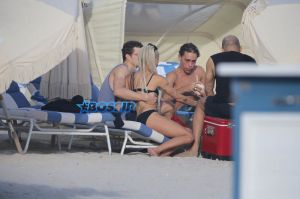 Actor couple Zoe Kravitz and Karl Glusman get flirty as they take a swim and relax on the beach in Miami, Florida. KDNPIX Splashnews