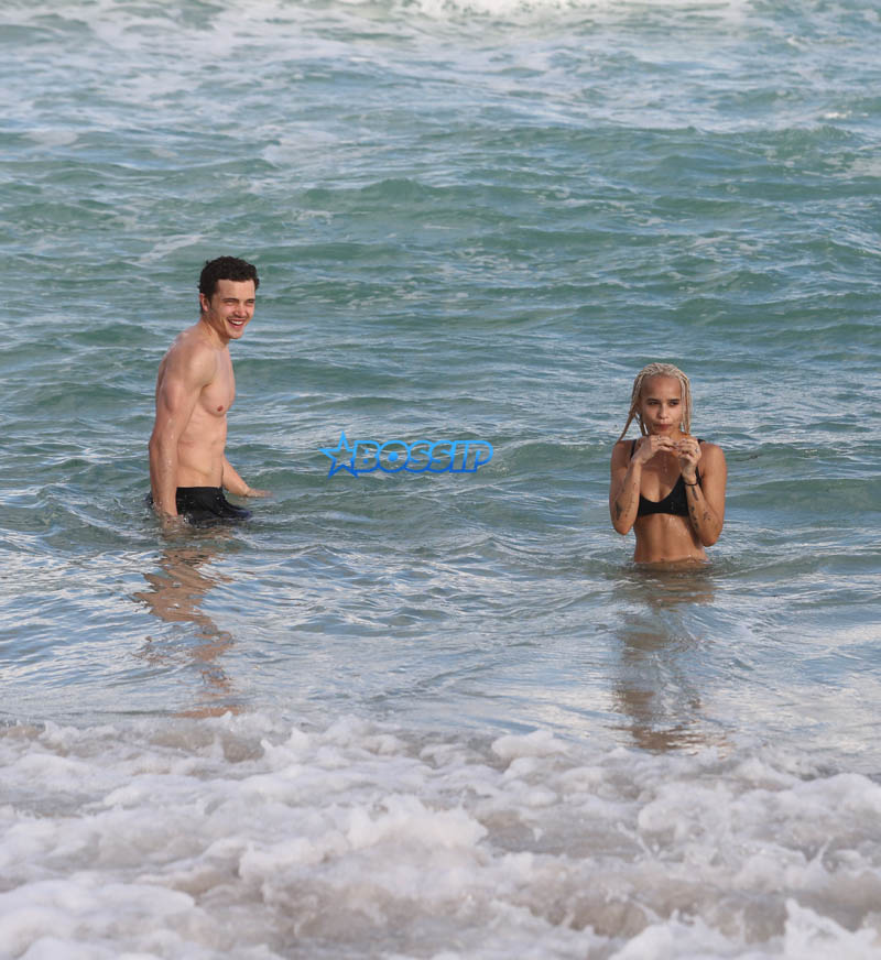 Actor couple Zoe Kravitz and Karl Glusman get flirty as they take a swim and relax on the beach in Miami, Florida. KDNPIX Splashnews