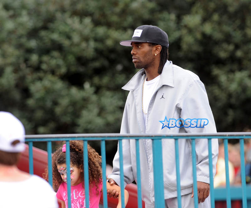 NFL star Randy Moss of the New England Patriots celebrated a day of family fun with his daughter at Walt Disney World in Orlando, Fla. SplashNews