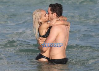 Actor couple Zoe Kravitz and Karl Glusman get flirty as they take a swim and relax on the beach in Miami, Florida. KDNPIX Splashnews
