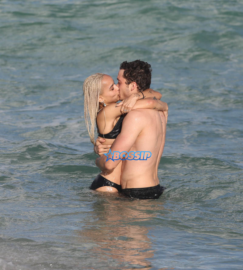 Actor couple Zoe Kravitz and Karl Glusman get flirty as they take a swim and relax on the beach in Miami, Florida. KDNPIX Splashnews