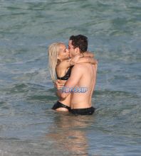 Actor couple Zoe Kravitz and Karl Glusman get flirty as they take a swim and relax on the beach in Miami, Florida. KDNPIX Splashnews