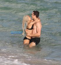 Actor couple Zoe Kravitz and Karl Glusman get flirty as they take a swim and relax on the beach in Miami, Florida. KDNPIX Splashnews