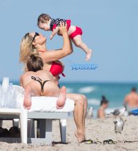Coco Austin bikini body beach Miami baby Chanel on vacation with husband Ice T SplashNews