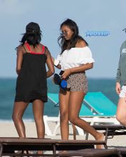 Sasha Obama beach in Miami President Obama's 15-year-old daughter Saturday afternoon. surrounded by secret service agents in plain clothes and hotel security. black bikini top print shorts white off the shoulder top SplashNews