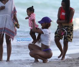 Teyana Taylor purple thong beach vacation in Miami. Baby Junie aka Iman Tayla Shumpert SplashNews