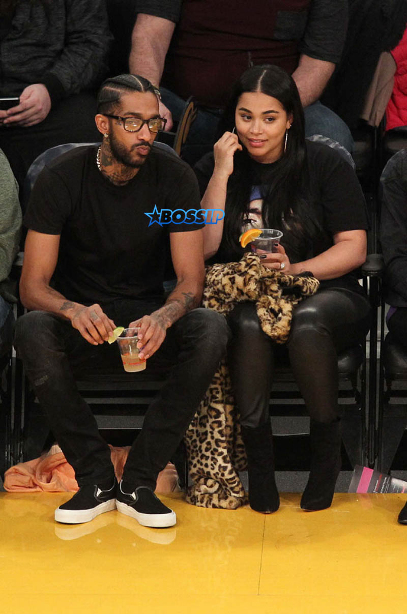 Nipsey Hussle and Lauren London seen out at the Lakers vs. Spurs game at the Staples Center in Los Angeles, California. SplashNews