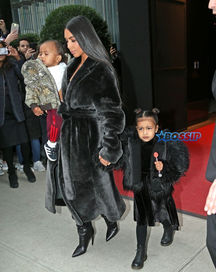 Kim Kardashian steps out with Jonathan Cheban and kids North and Saint West for lunch and North plays with a bull statue outside of the restaurant in New York City. Pictured: kim kardashian, north west, saint west, jonathan cheban Ref: SPL1431837 010217 Picture by: Ryan Turgeon / Splash News Splash News and Pictures Los Angeles:310-821-2666 New York:212-619-2666 London:870-934-2666 photodesk@splashnews.com