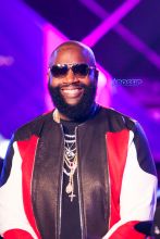 Hip-hop artist Rick Ross performs onstage at the MTV Woodies Awards during SXSW in Austin, Texas, USA. White Puma jogging suit diamond chains rings watch sunglasses SplashNews