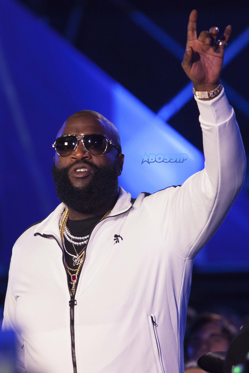 Hip-hop artist Rick Ross performs onstage at the MTV Woodies Awards during SXSW in Austin, Texas, USA.  White Puma jogging suit diamond chains rings watch sunglasses SplashNews