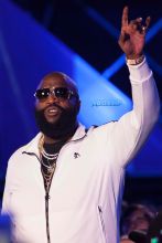 Hip-hop artist Rick Ross performs onstage at the MTV Woodies Awards during SXSW in Austin, Texas, USA. White Puma jogging suit diamond chains rings watch sunglasses SplashNews