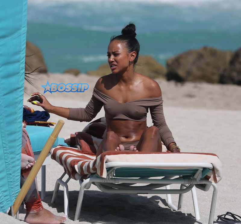 15 APRIL 2017 Karrueche Tran enjoys relaxing on the beach with her friends in a tan bikini. The actress leafs through a script titled "Claws" and seems to be a TV script as it also indicates it has episodes. The script is directed by 'Mozart in the Jungle' director Tricia Brock and written by Leila Gerstein who has written scripts for 'Gossip Girl' 'The OC' and 'Hart of Dixie'. Pictured: Karrueche Tran OHPIX/SplashNews
