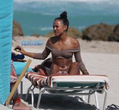 15 APRIL 2017 Karrueche Tran enjoys relaxing on the beach with her friends in a tan bikini. The actress leafs through a script titled "Claws" and seems to be a TV script as it also indicates it has episodes. The script is directed by 'Mozart in the Jungle' director Tricia Brock and written by Leila Gerstein who has written scripts for 'Gossip Girl' 'The OC' and 'Hart of Dixie'. Pictured: Karrueche Tran OHPIX/SplashNews