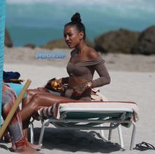 15 APRIL 2017 Karrueche Tran enjoys relaxing on the beach with her friends in a tan bikini. The actress leafs through a script titled "Claws" and seems to be a TV script as it also indicates it has episodes. The script is directed by 'Mozart in the Jungle' director Tricia Brock and written by Leila Gerstein who has written scripts for 'Gossip Girl' 'The OC' and 'Hart of Dixie'. Pictured: Karrueche Tran OHPIX/SplashNews