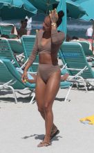 15 APRIL 2017 Karrueche Tran enjoys relaxing on the beach with her friends in a tan bikini. The actress leafs through a script titled "Claws" and seems to be a TV script as it also indicates it has episodes. The script is directed by 'Mozart in the Jungle' director Tricia Brock and written by Leila Gerstein who has written scripts for 'Gossip Girl' 'The OC' and 'Hart of Dixie'. Pictured: Karrueche Tran OHPIX/SplashNews