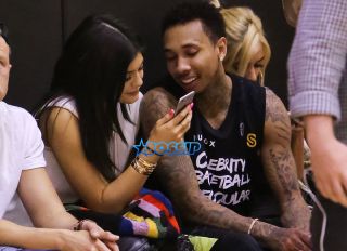 LOS ANGELES, CA - MAY 30: Reality TV Personality Kylie Jenner (L) and Rapper Tyga (R) attend the "Celebrity Basketball Spectacular" to benefit the Sports Spectacular at Equinox Sports Club West LA on May 30, 2015 in Los Angeles, California. (Photo by Paul Archuleta/FilmMagic)
