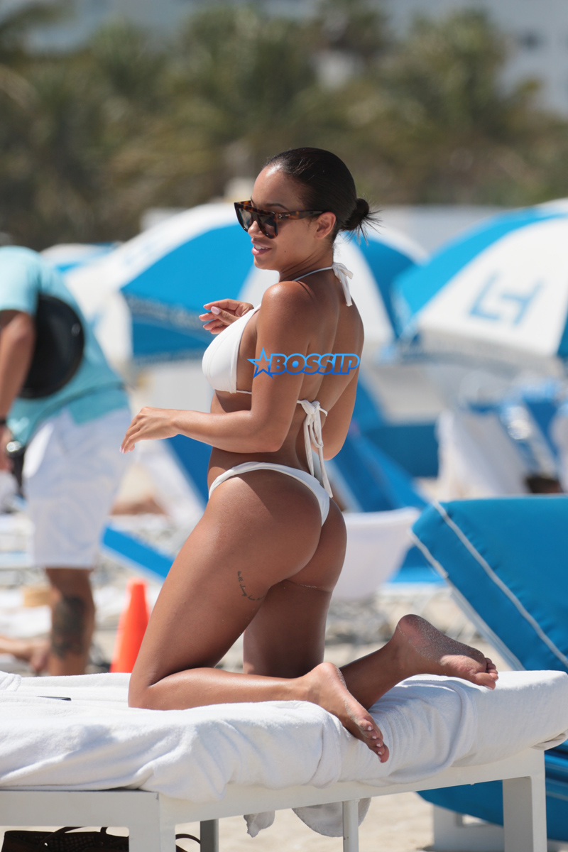 SplashNews American model Jordan Ozuna wears a white thong bikini at the beach in Miami Beach, FL. Tyga was seen courting Jordan in April on a date in Beverly Hills. 