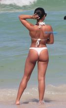 American model Jordan Ozuna wears a white thong bikini at the beach in Miami Beach, FL. Tyga was seen courting Jordan in April on a date in Beverly Hills. SplashNews